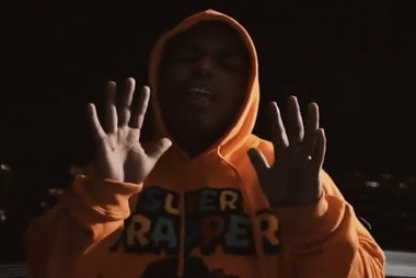 Smiley wearing Super Trapper in "30" Video